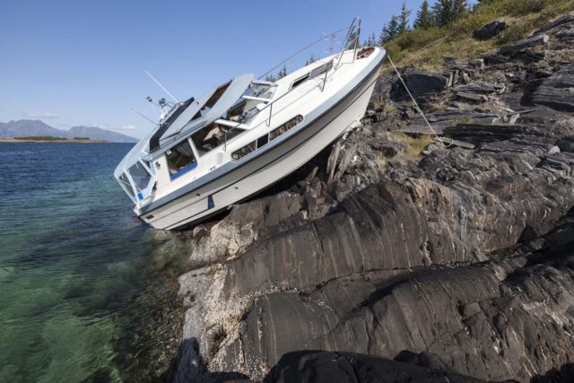 Close,Up,Photo,Of,Recreational,Boat,High,And,Dry,After